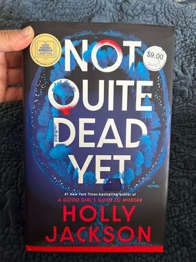 Not Quite Dead Yet by Holly Jackson - Blue & Red Hardcover Novel